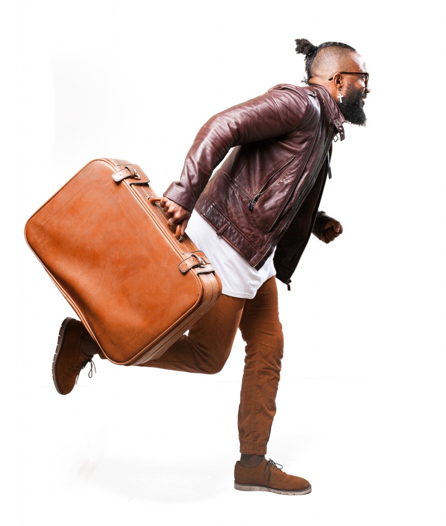 full body black man running with a leather bag